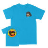Juan Machado “The Most Powerful Wink” Turquoise T-Shirt